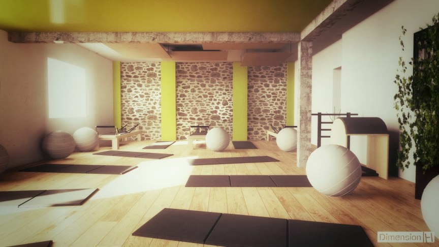 Rénovation d'un ancien garage en salle de Pilates avec mur en pierres